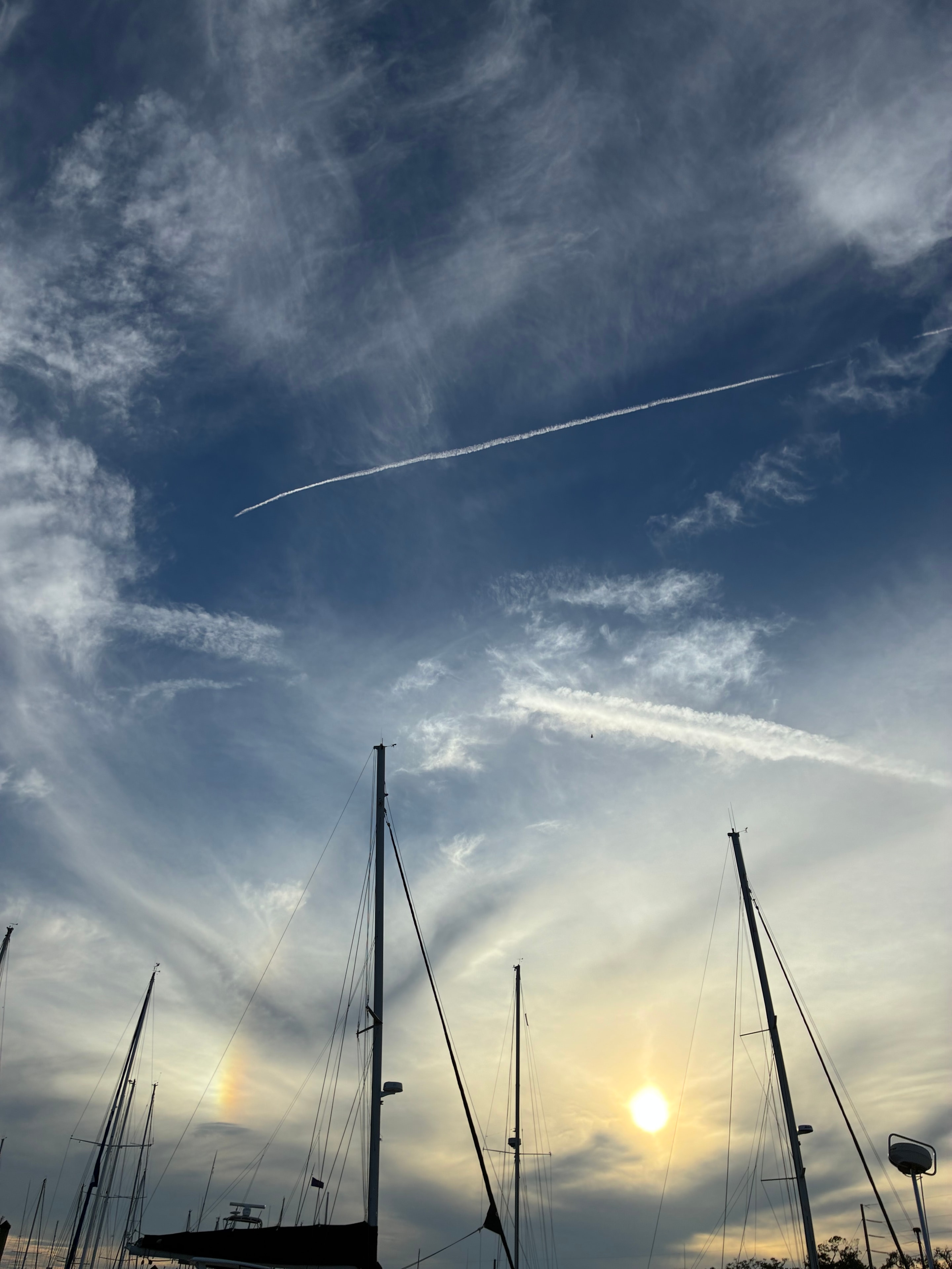 Sailboat masts against a glowing sky in Saint Augustine, Florida